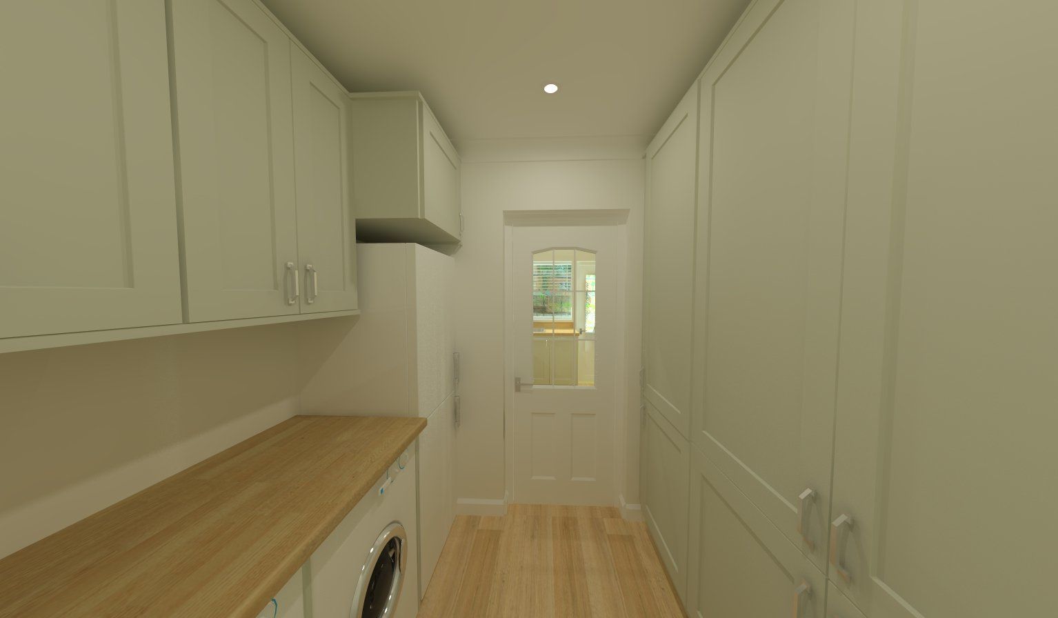 Laundry room interior with light green cabinets and wood countertop, a door at the end.
