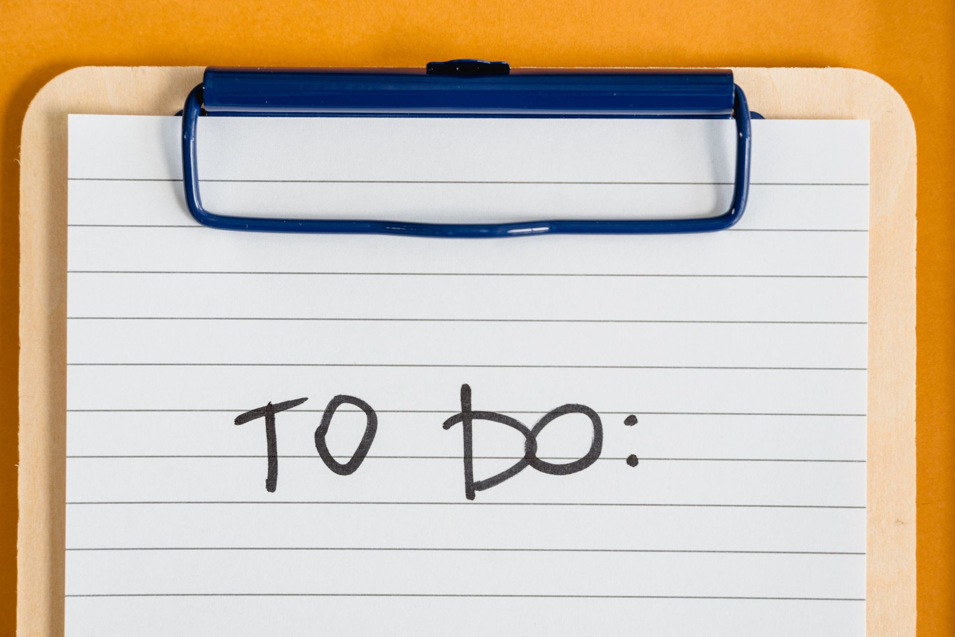 Clipboard with lined paper and handwritten “To Do” note