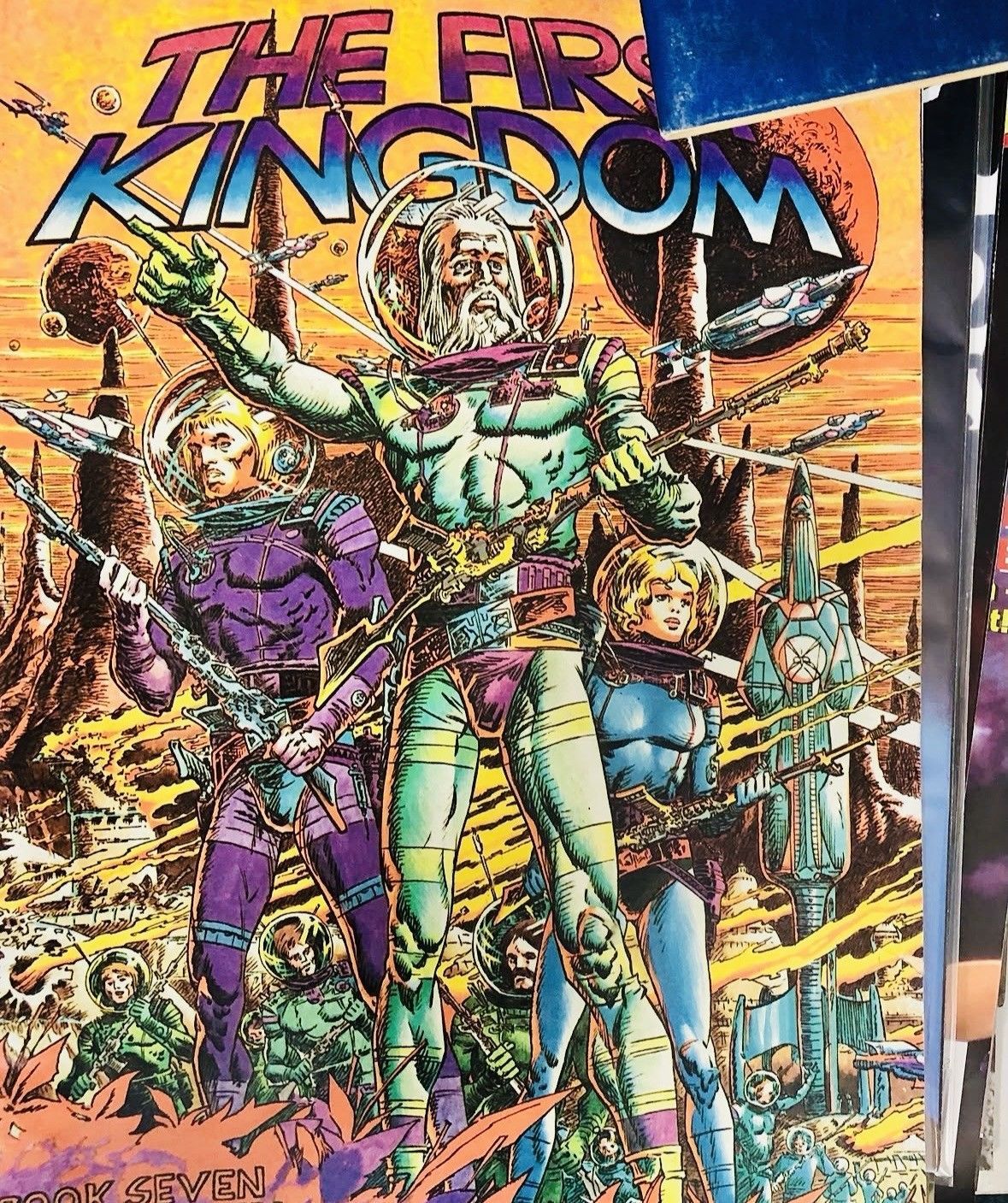 Colorful sci-fi comic cover titled “The Free Kingdom” with armored characters standing in a desert landscape.