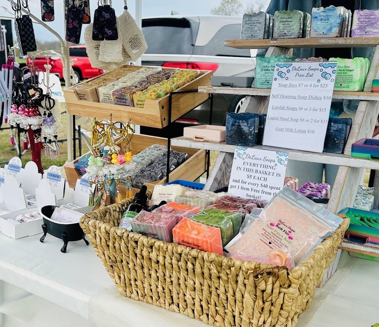 Outdoor market stall with woven baskets of colorful packaged goods and handmade items on display.