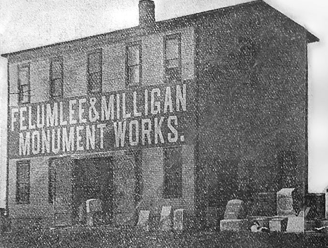 Black and white photo of the Felumlee & Milligan Monument Works building. Several monuments sit in front.
