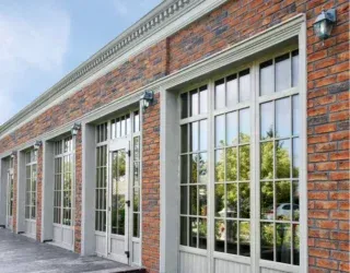 A brick building with a lot of windows and doors