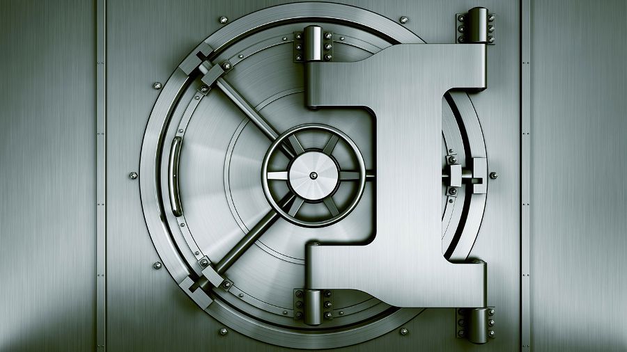 A close up of a metal safe with the door open