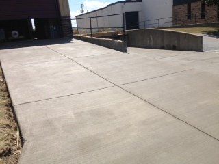 entryway of concrete into warehouse building