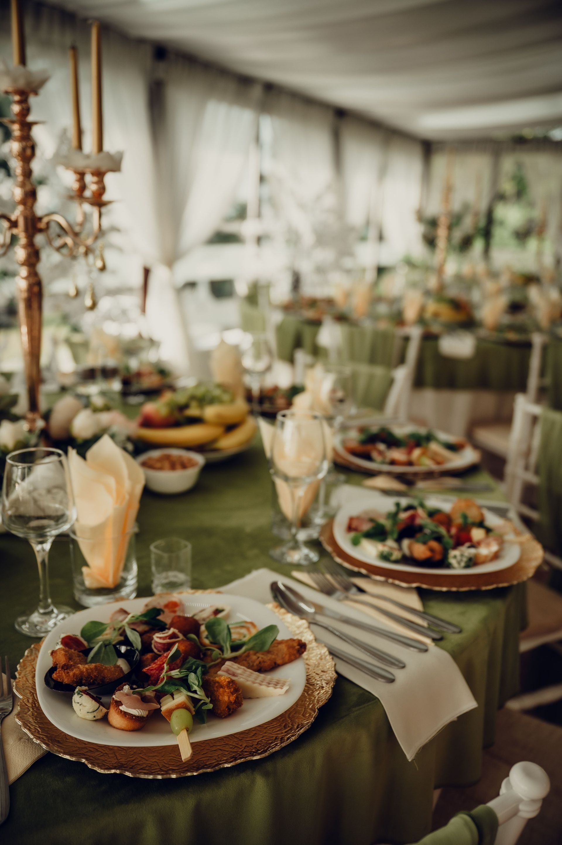 Corporate catering setup with formal table settings, glassware, and professional event service