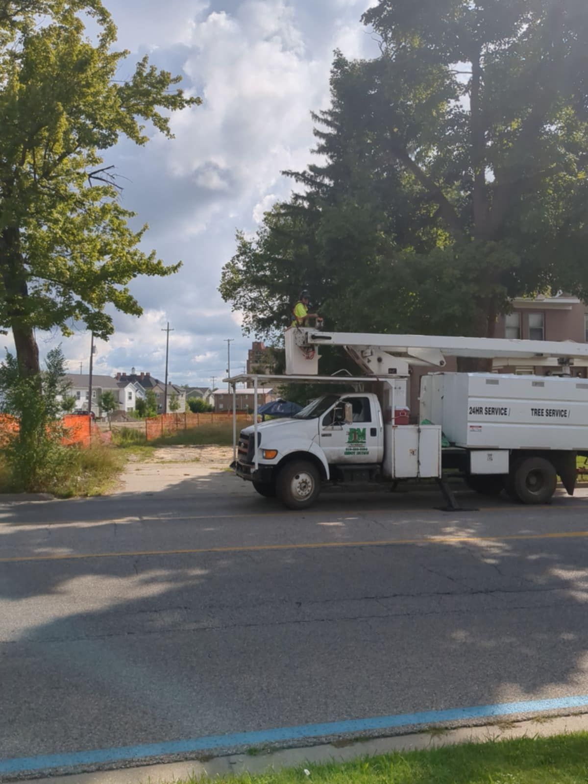 A white truck is parked on the side of the road