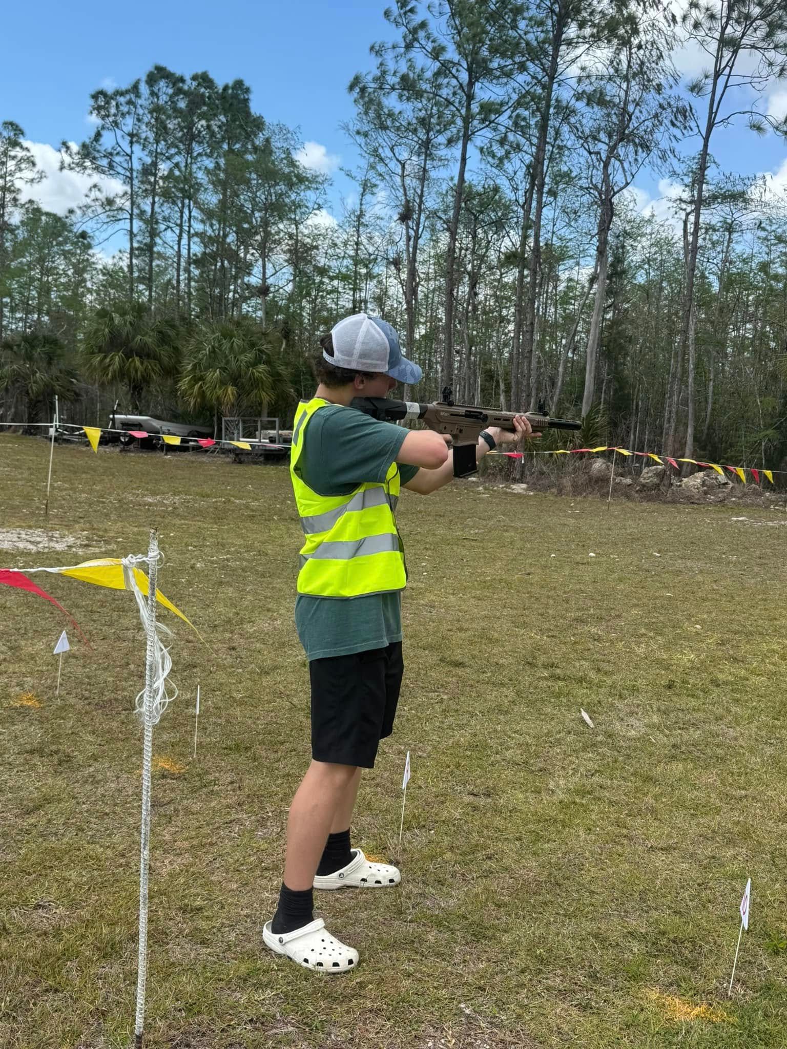 man shooting a gun