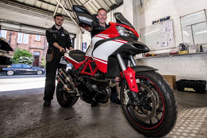 mechanics with motorcycle