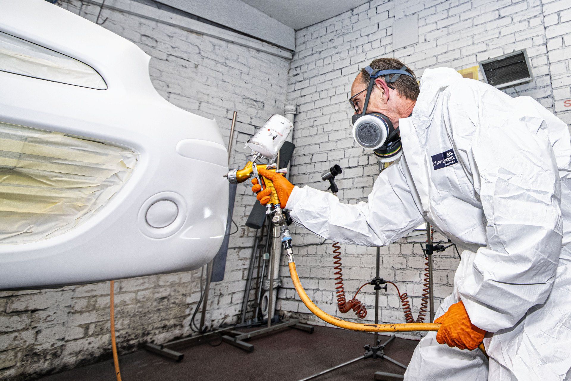 mechanic respraying bodywork