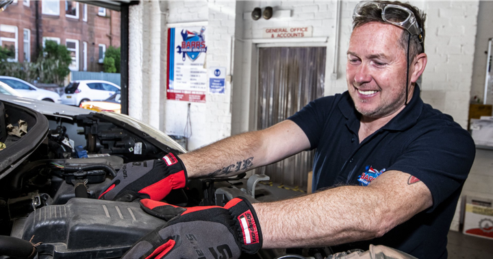 mechanic working on vehicle