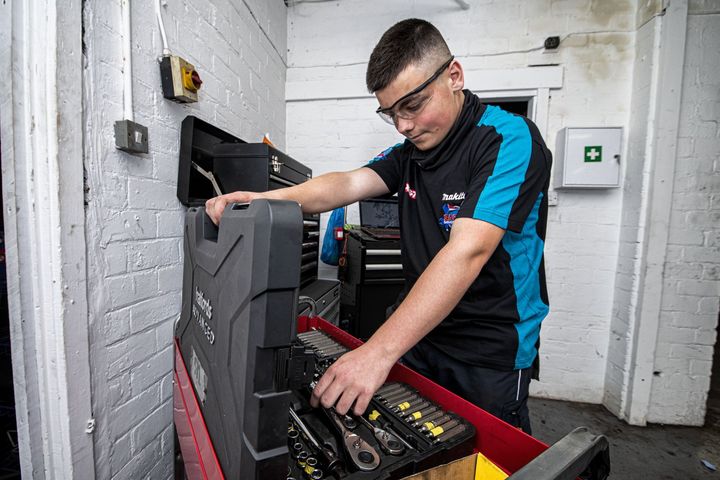 mechanic looking at tool set