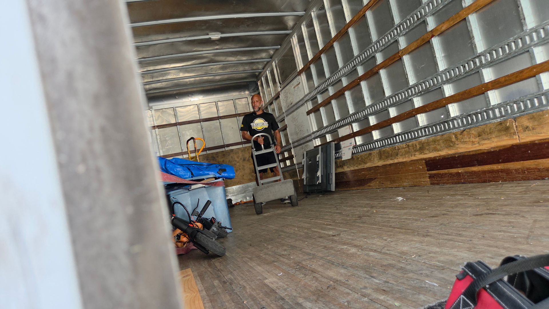 Workers Moving Out The Sofa
