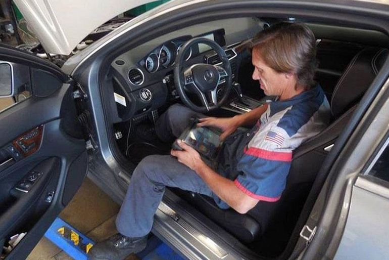 Man Performing Automotive Diagnostics — Lancaster, CA — Wayne & Dave's Automotive