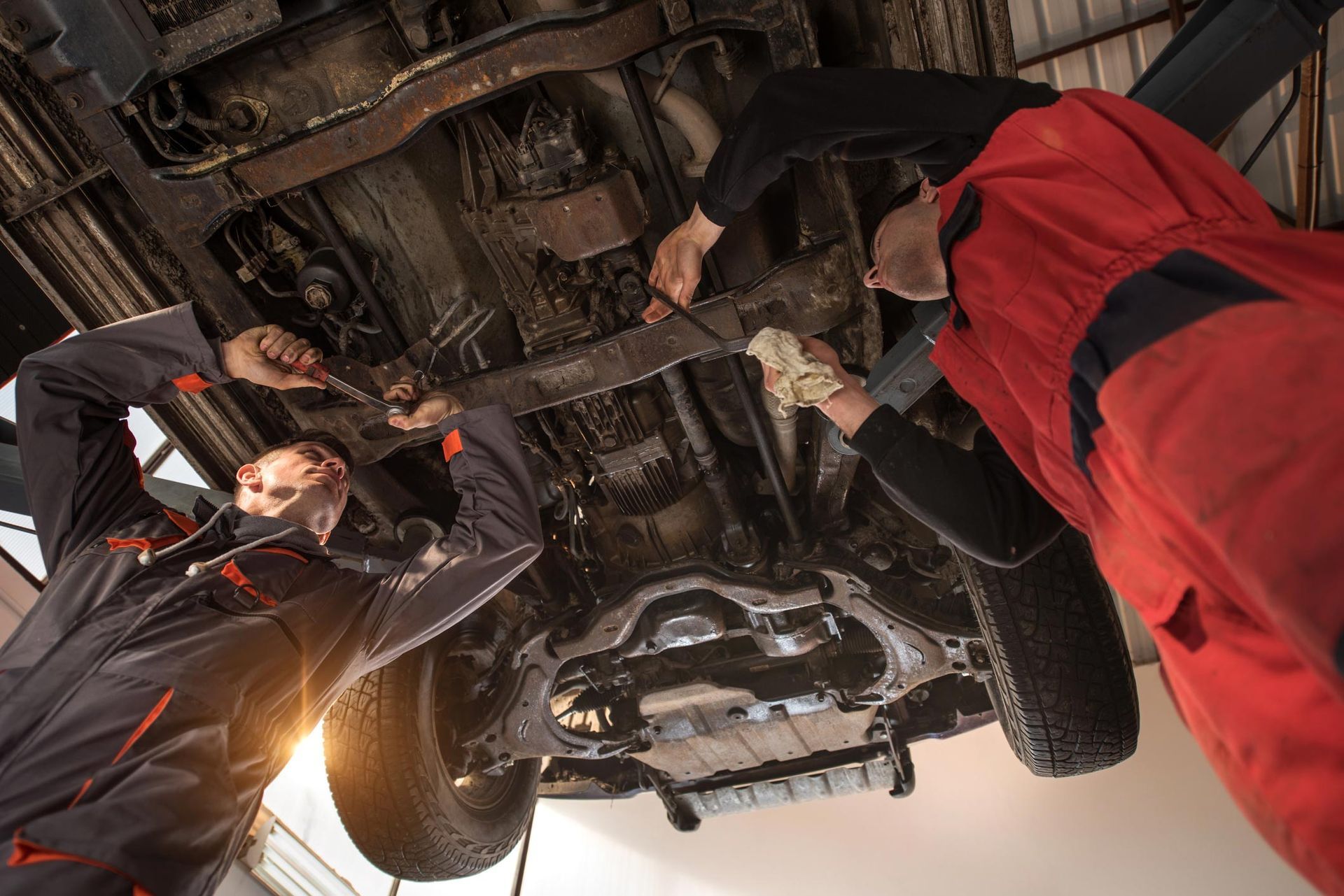 Two Mechanics Repairing Car — Lancaster, CA — Wayne & Dave's Automotive Two Mechanics Repairing Car — Lancaster, CA — Wayne & Dave's Automotive