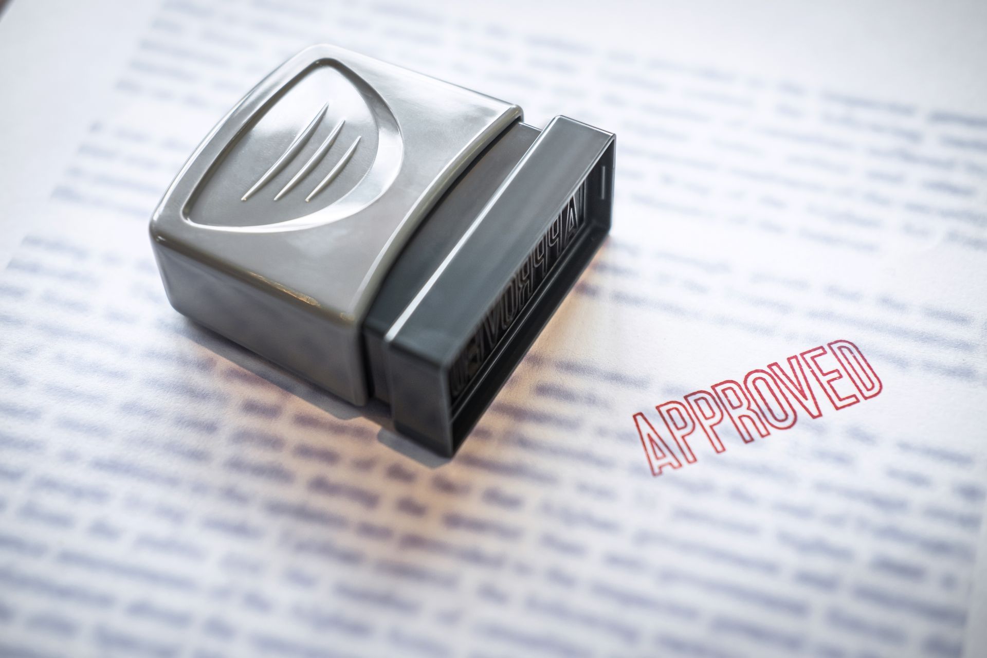 An older couple reviews documents with a financial advisor at a table.