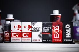 A shelf filled with a variety of car care products, Gtechniq brand.