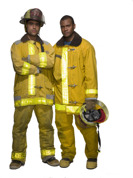Two firefighters are standing next to each other with one having their  arms crossed