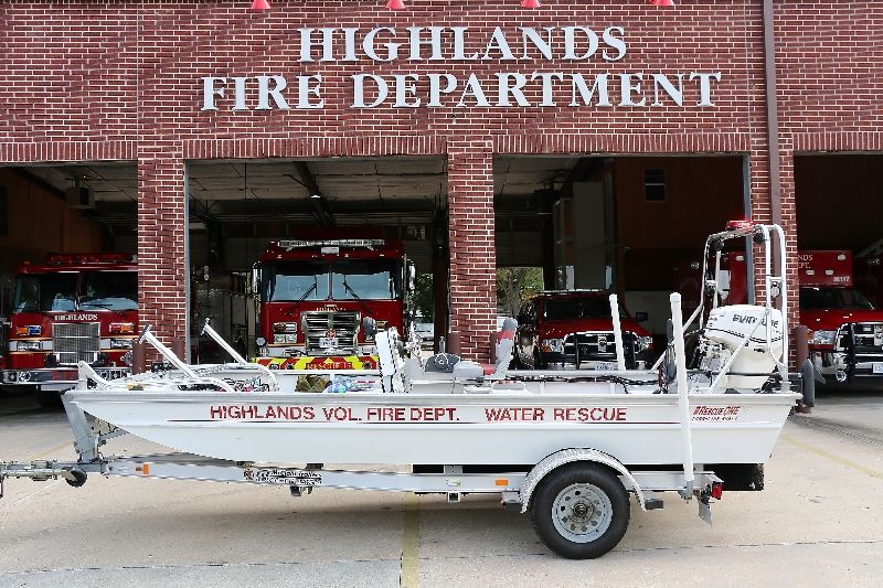A boat is parked in front of the Highlands fire department