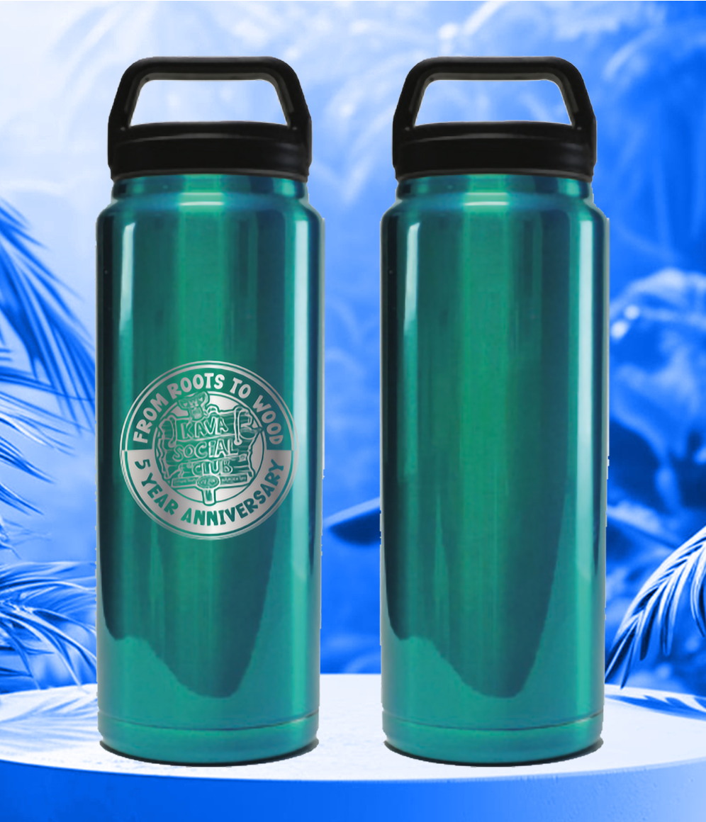Two green water bottles are sitting on a table with palm trees in the background.