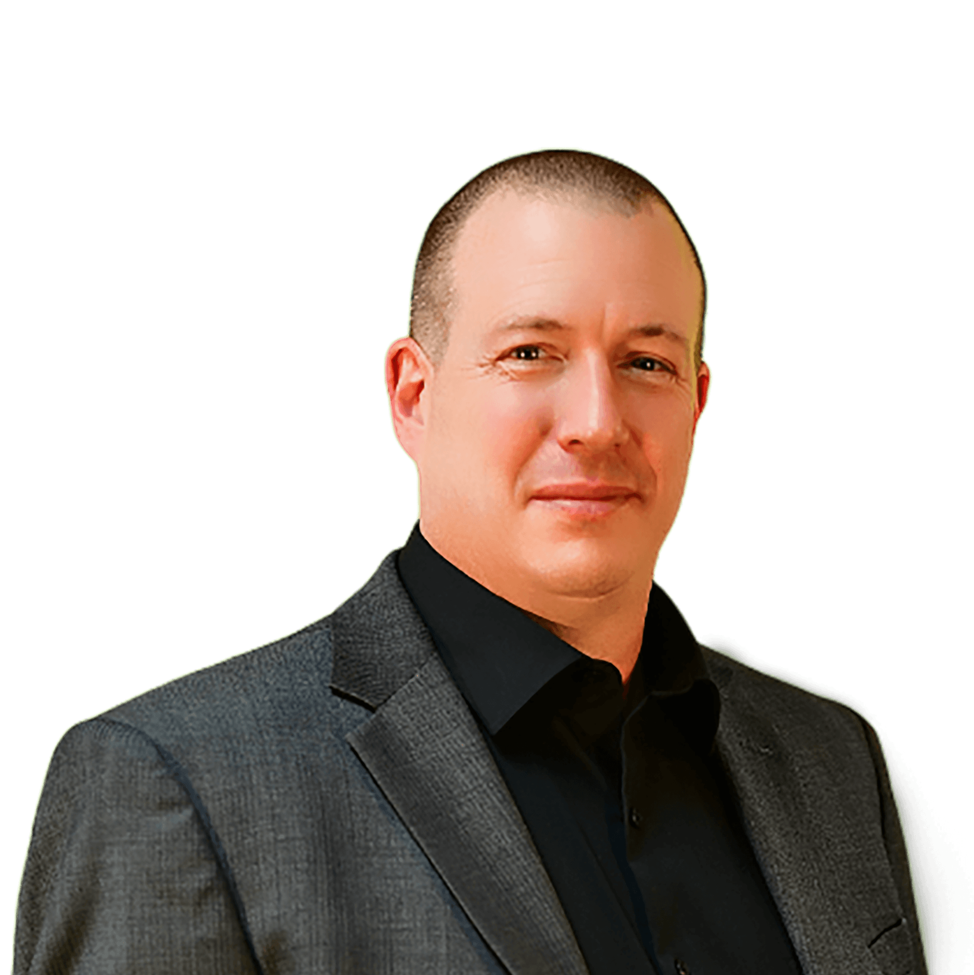 Man in black shirt and gray blazer, looking forward with a slight smile.