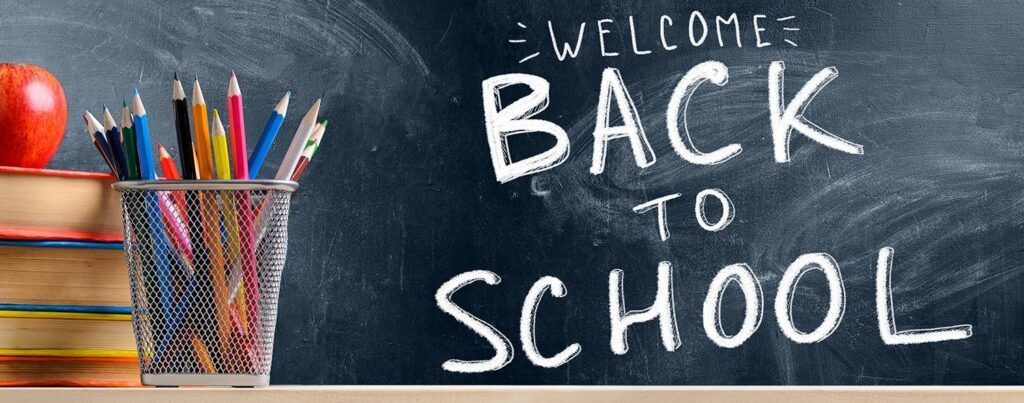 A blackboard with the words welcome back to school written on it
