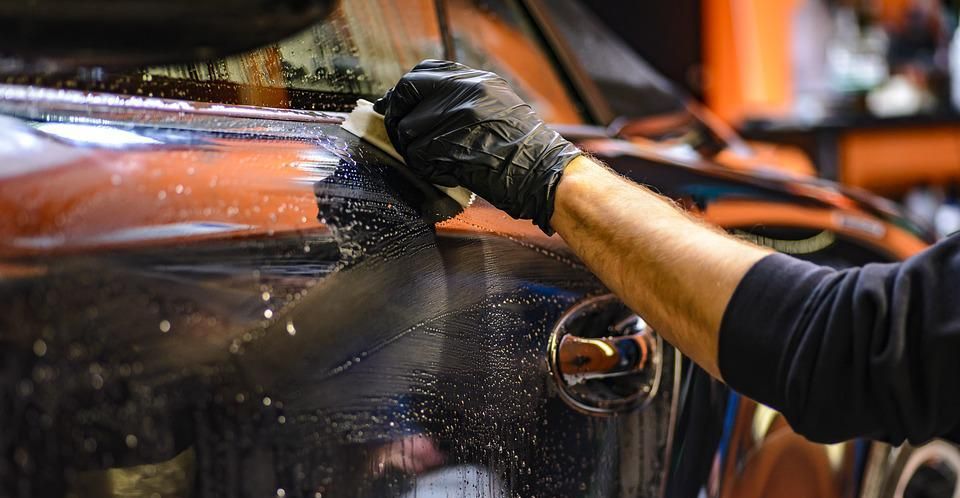 The Detail Freaks staff applying Ceramic Coating