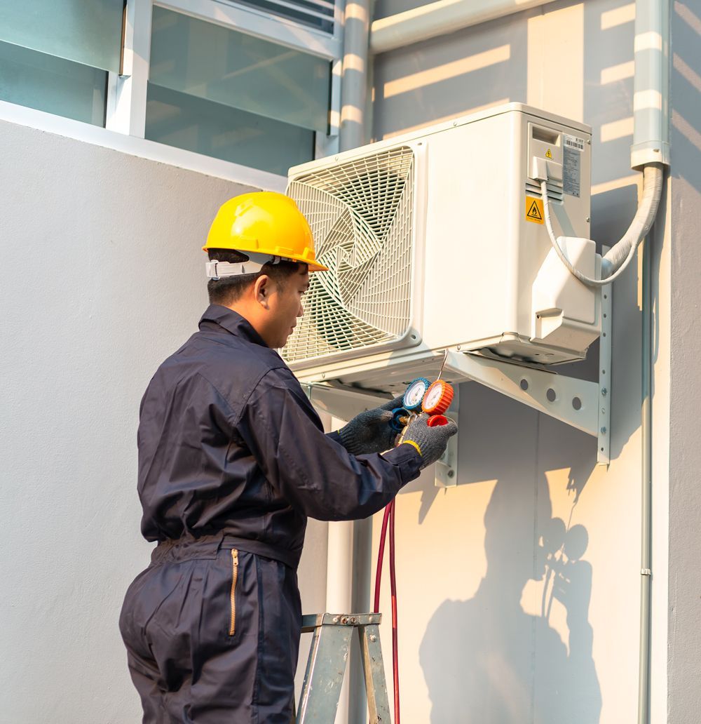 Man Repairing Air Conditioner — Bradenton, FL — Comfort Kings Heating Cooling & Refrigeration Man Repairing Air Conditioner — Bradenton, FL — Comfort Kings Heating Cooling & Refrigeration