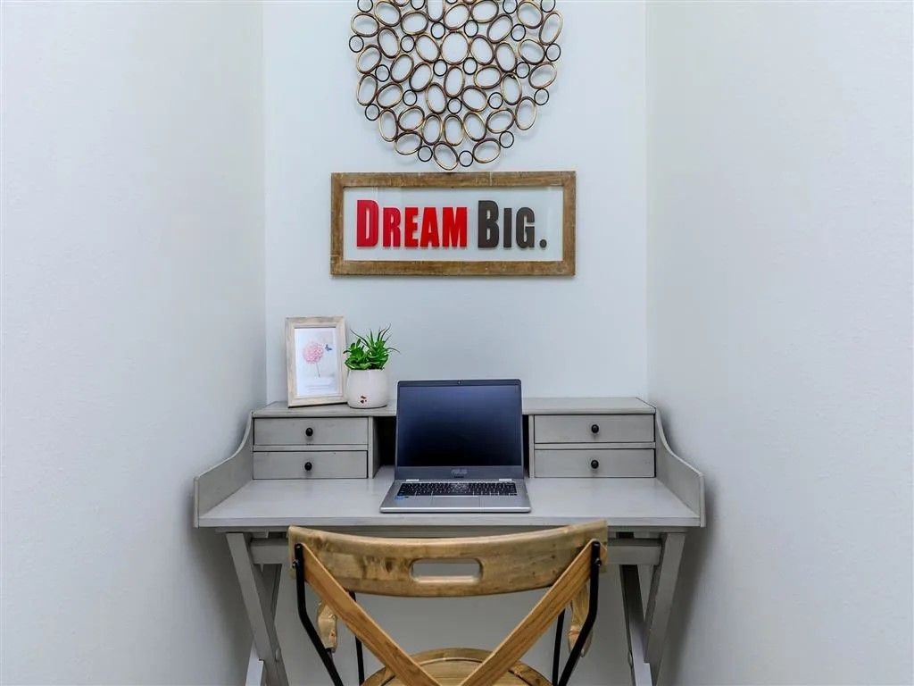 Desk setup with a laptop, framed