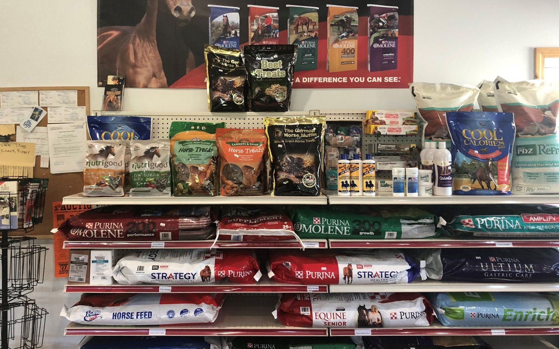 Store shelf with assorted pet foods and treats in colorful bags and boxes