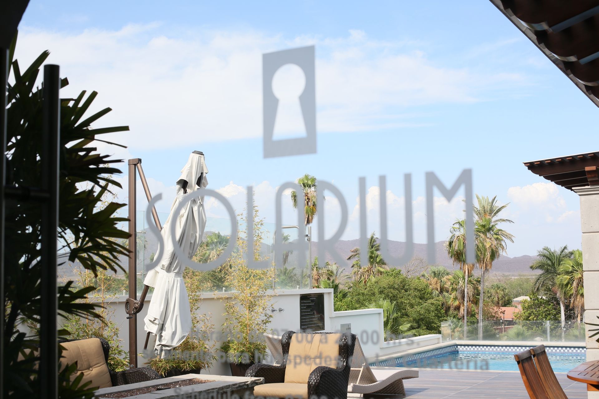 A view of a swimming pool with a sign that says solarium