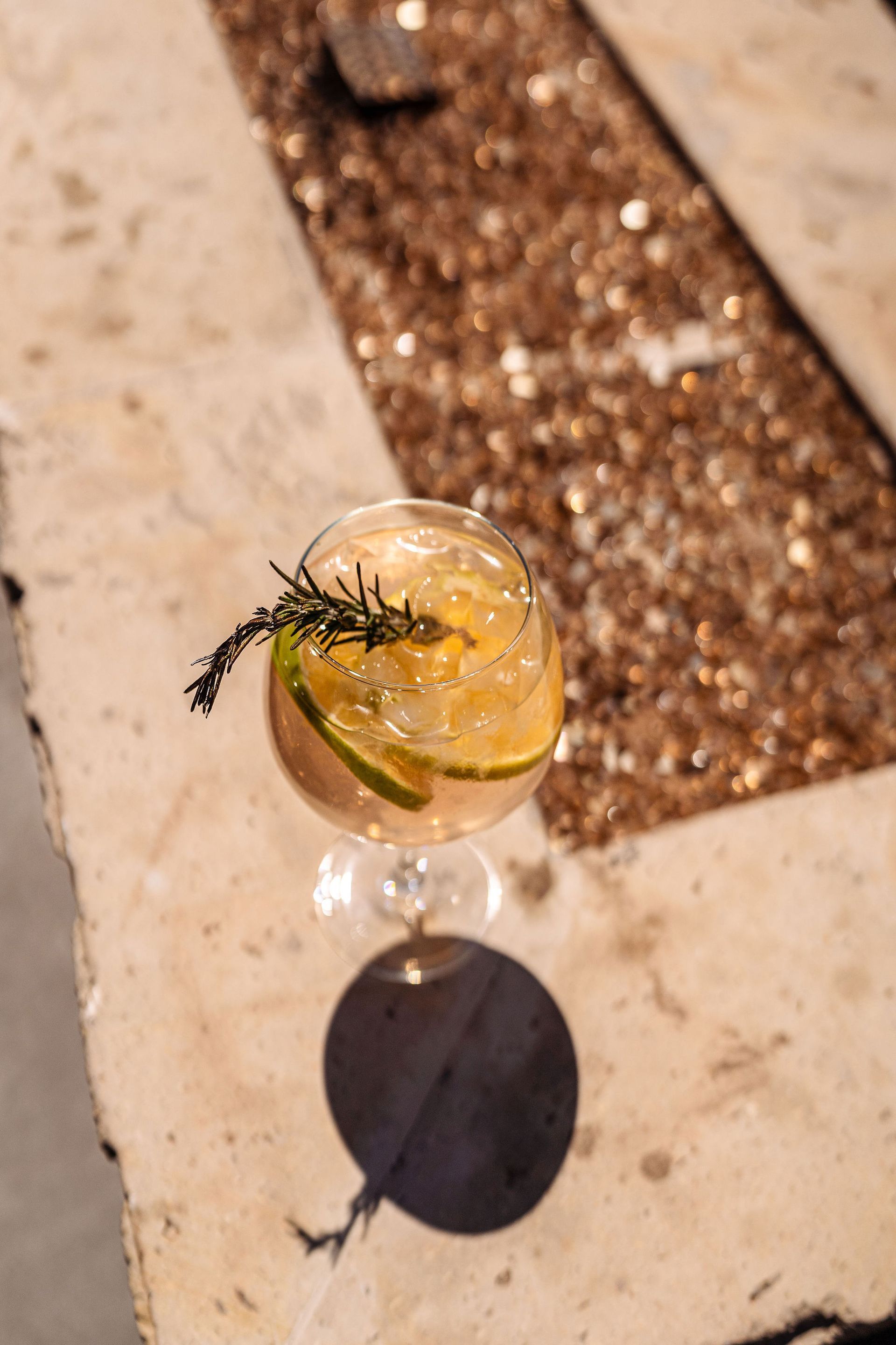 A close up of a drink in a glass on a table.
