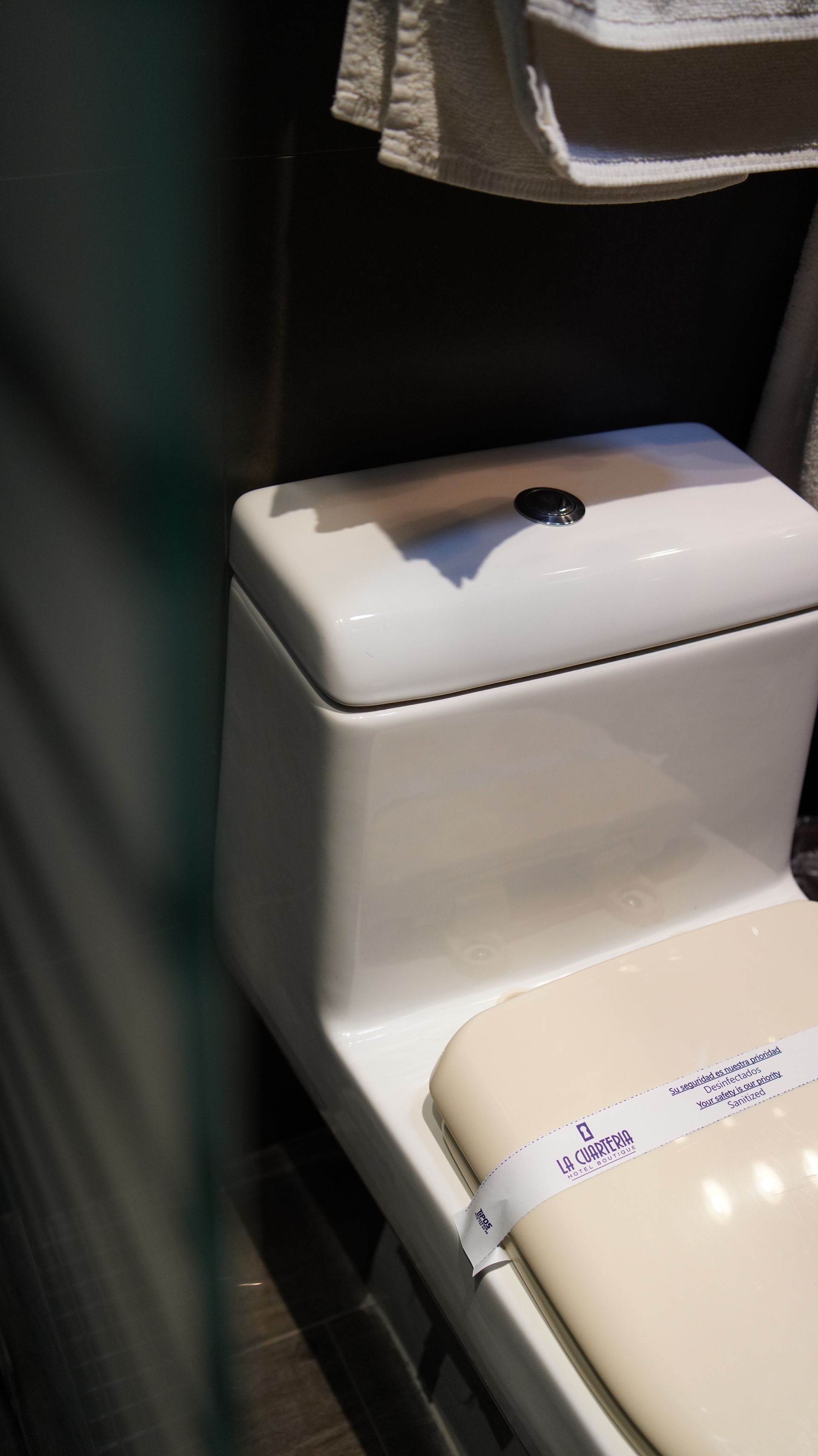 A close up of a toilet in a bathroom.