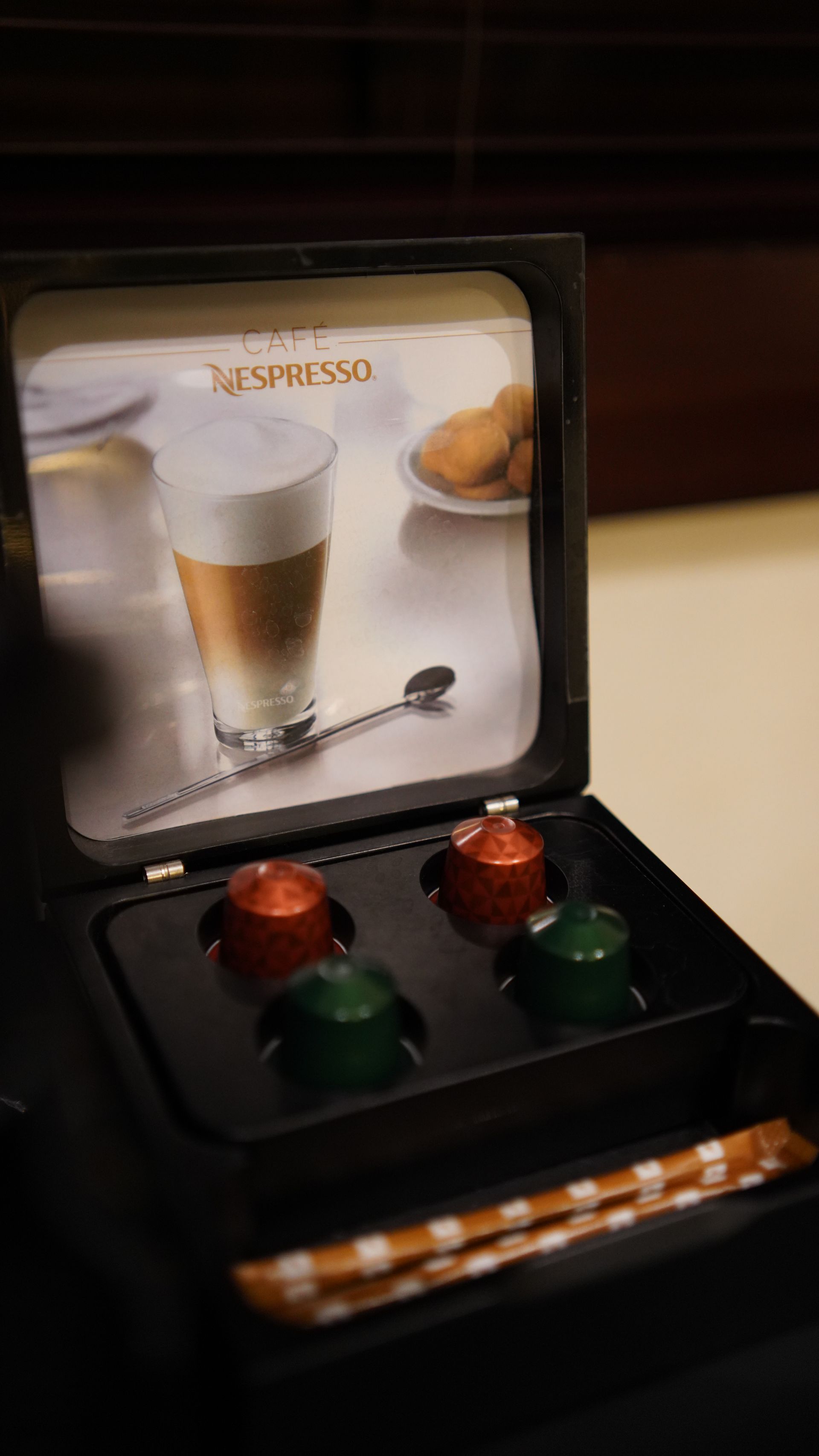 A box of nespresso capsules with a picture of a cup of coffee on it.