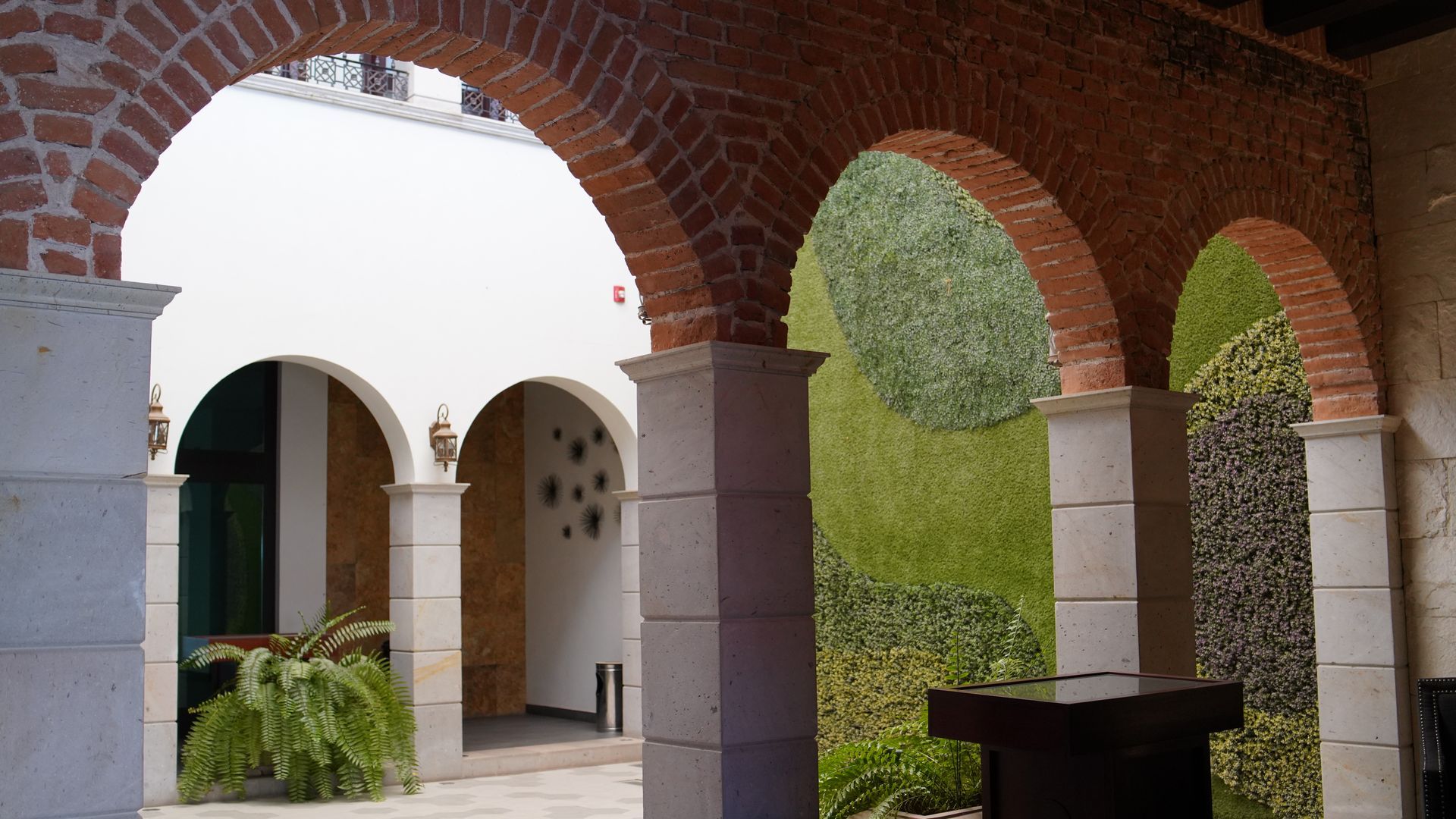 A courtyard with arches and columns in a building