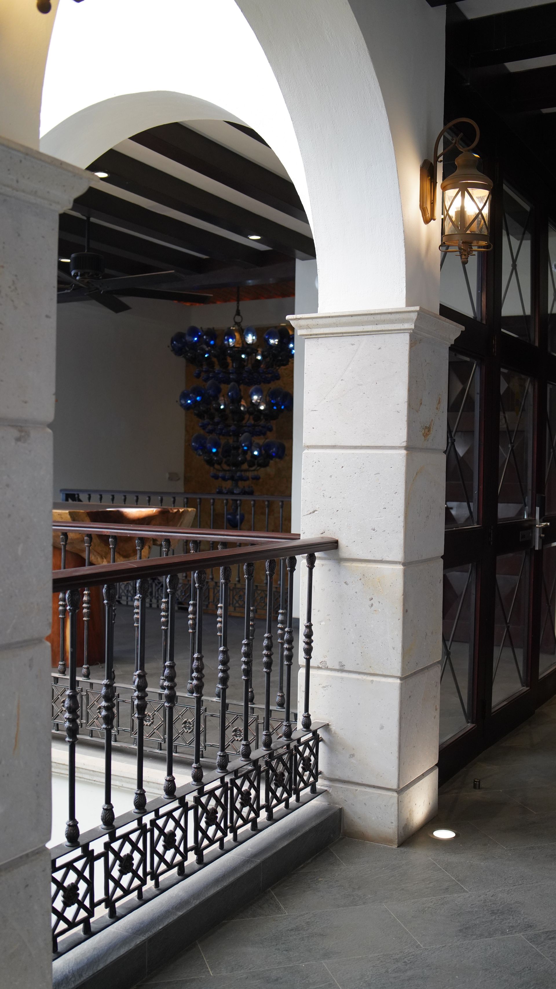 A balcony with a wrought iron railing in a building