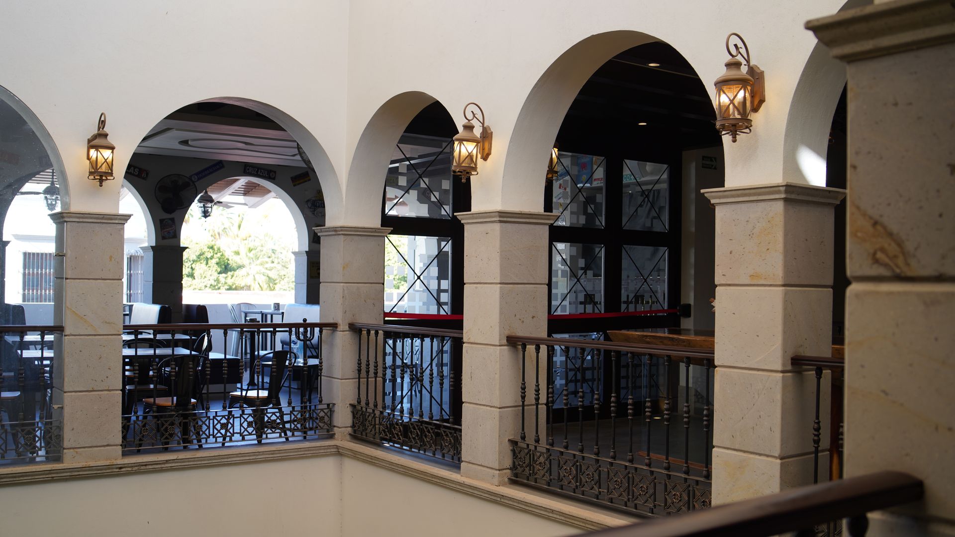The inside of a building with arches and columns