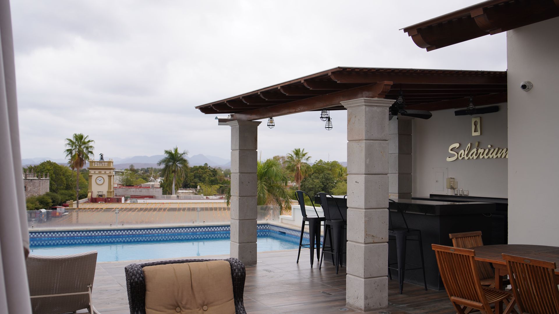 A patio with a pool and a sign that says solarium