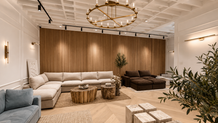 luxury commercial furniture showroom featuring custom wood slats, designer lighting, and premium architectural finishes