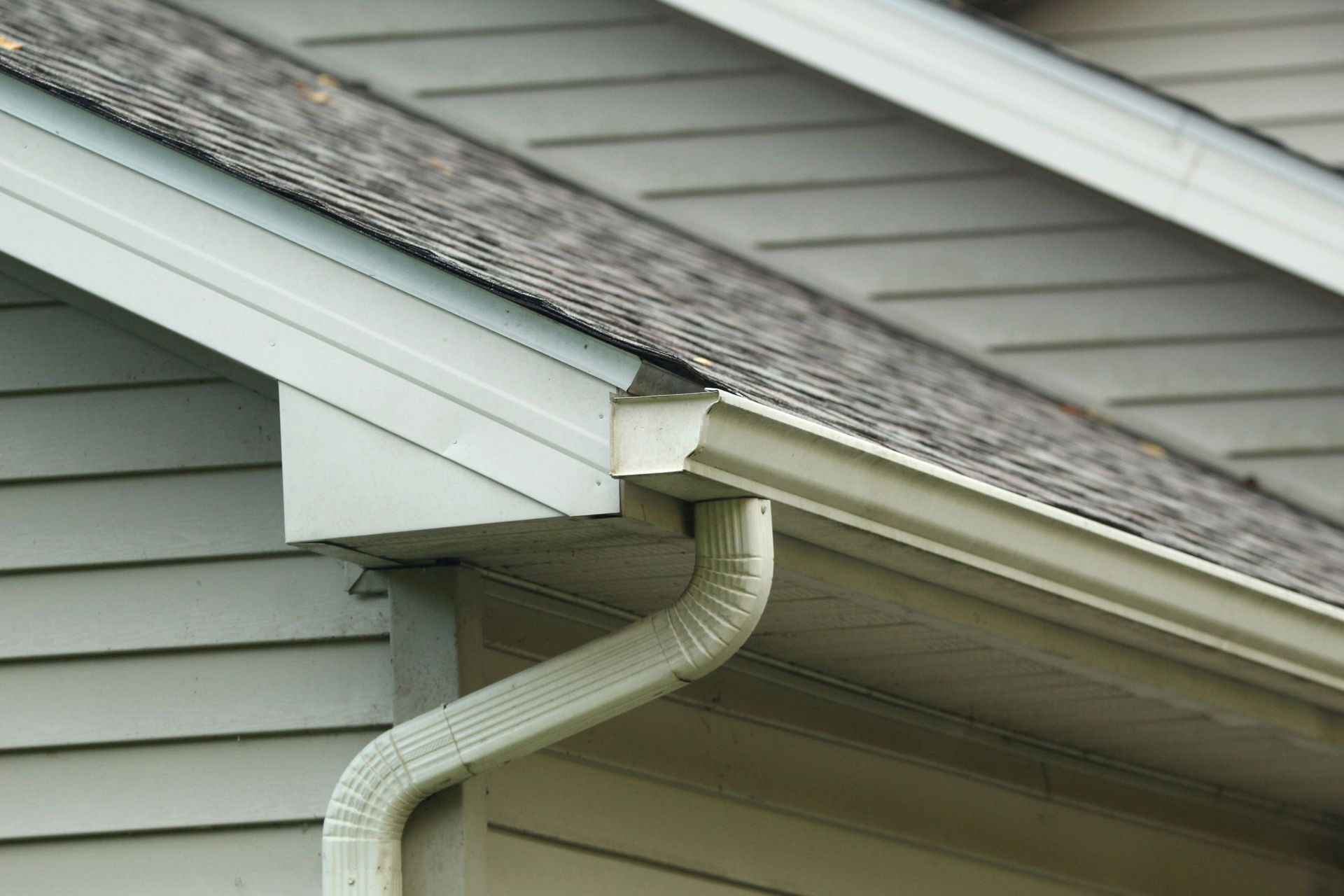 A close up of a gutter of a house