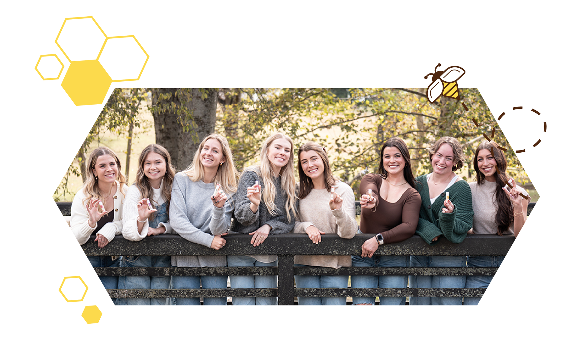 Group of women holding Honey Helps lip balms outdoors for natural skincare brand lifestyle photo