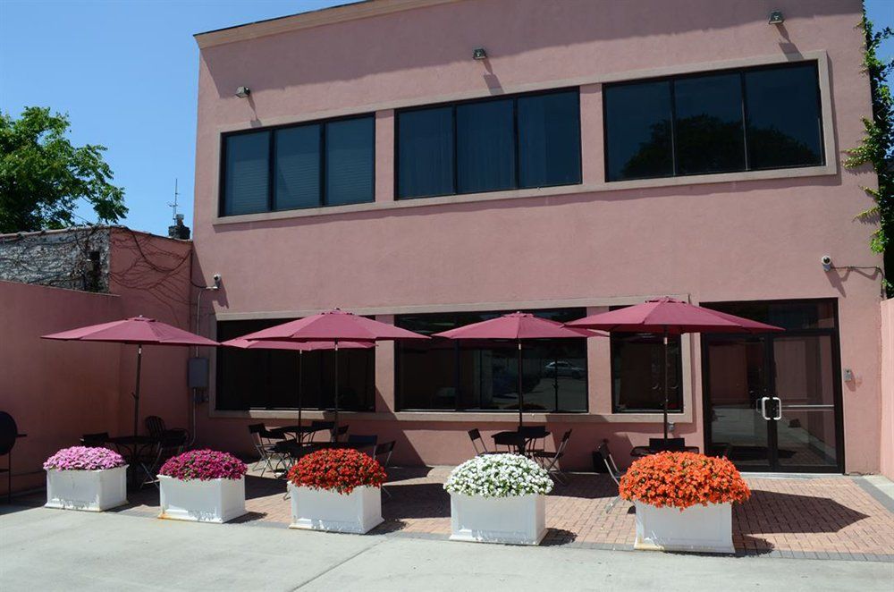 Building front with tables and flower decorations