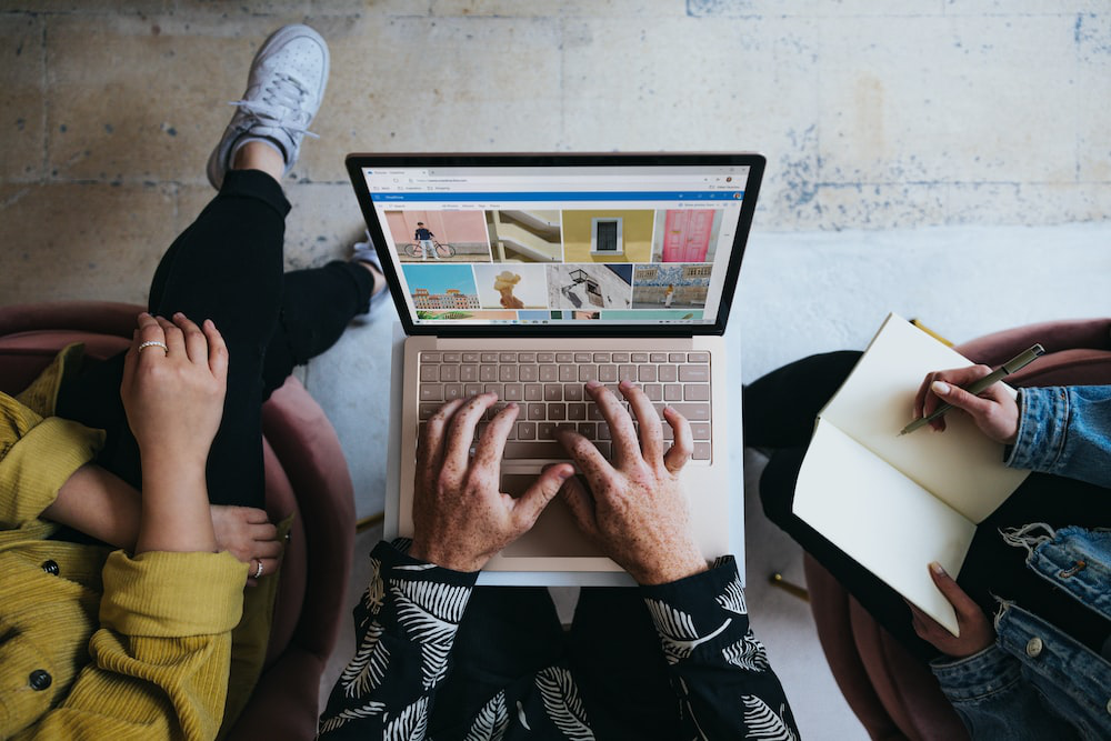 a person typing on a laptop