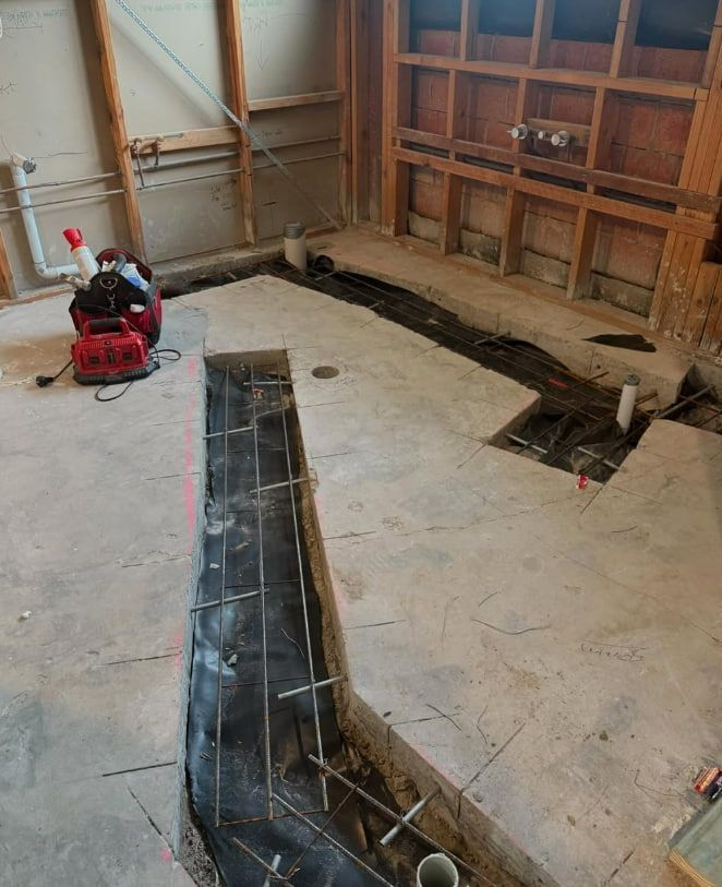 A Room With a Hole in the Floor and a Vacuum Cleaner on the Floor — Plumbtek Solutions In Mudgeeraba, QLD