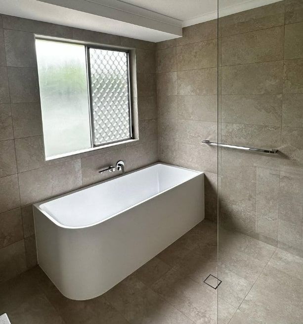 A Walk in Shower With a Hand Rail and a Shower Head — Plumbtek Solutions In Mudgeeraba, QLD