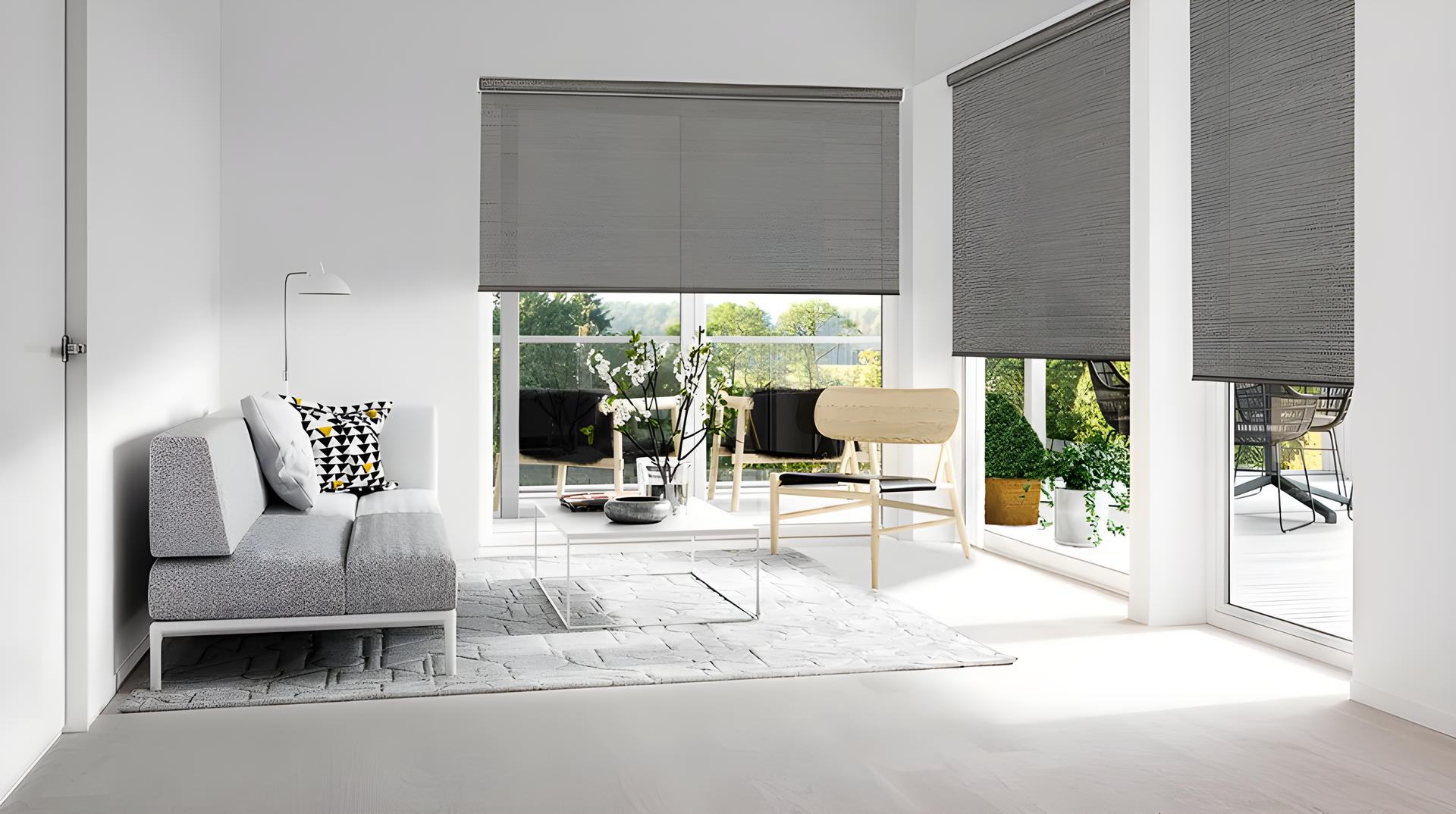 A living room with a couch, chairs , and window shades.
