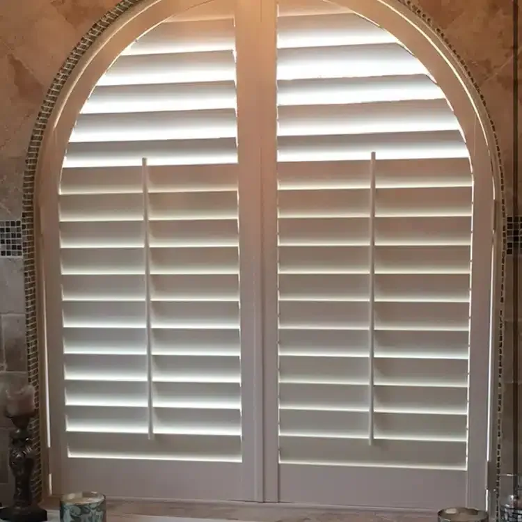 a bathroom with white composite shutter 
