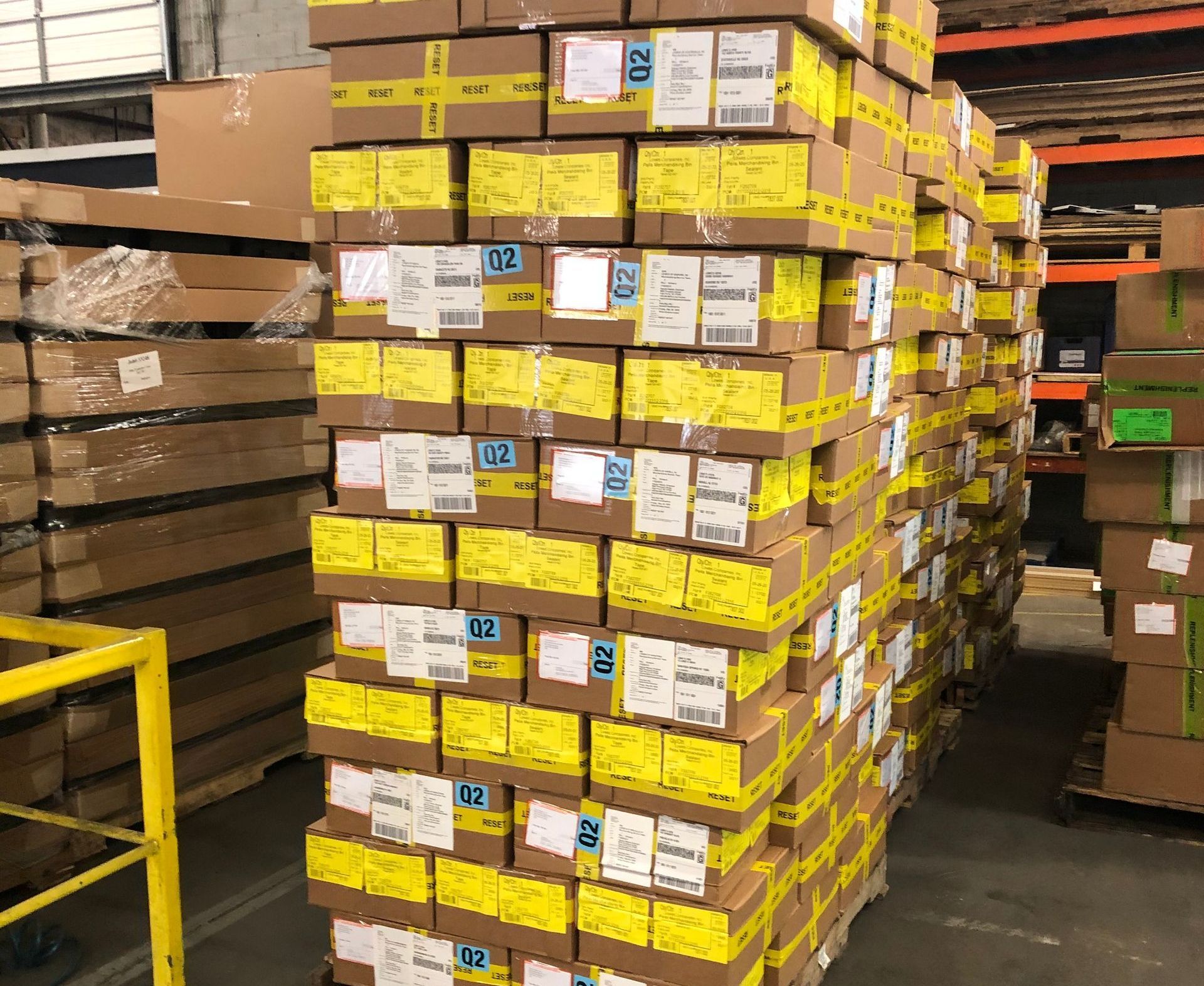 A warehouse filled with lots of boxes stacked on top of each other