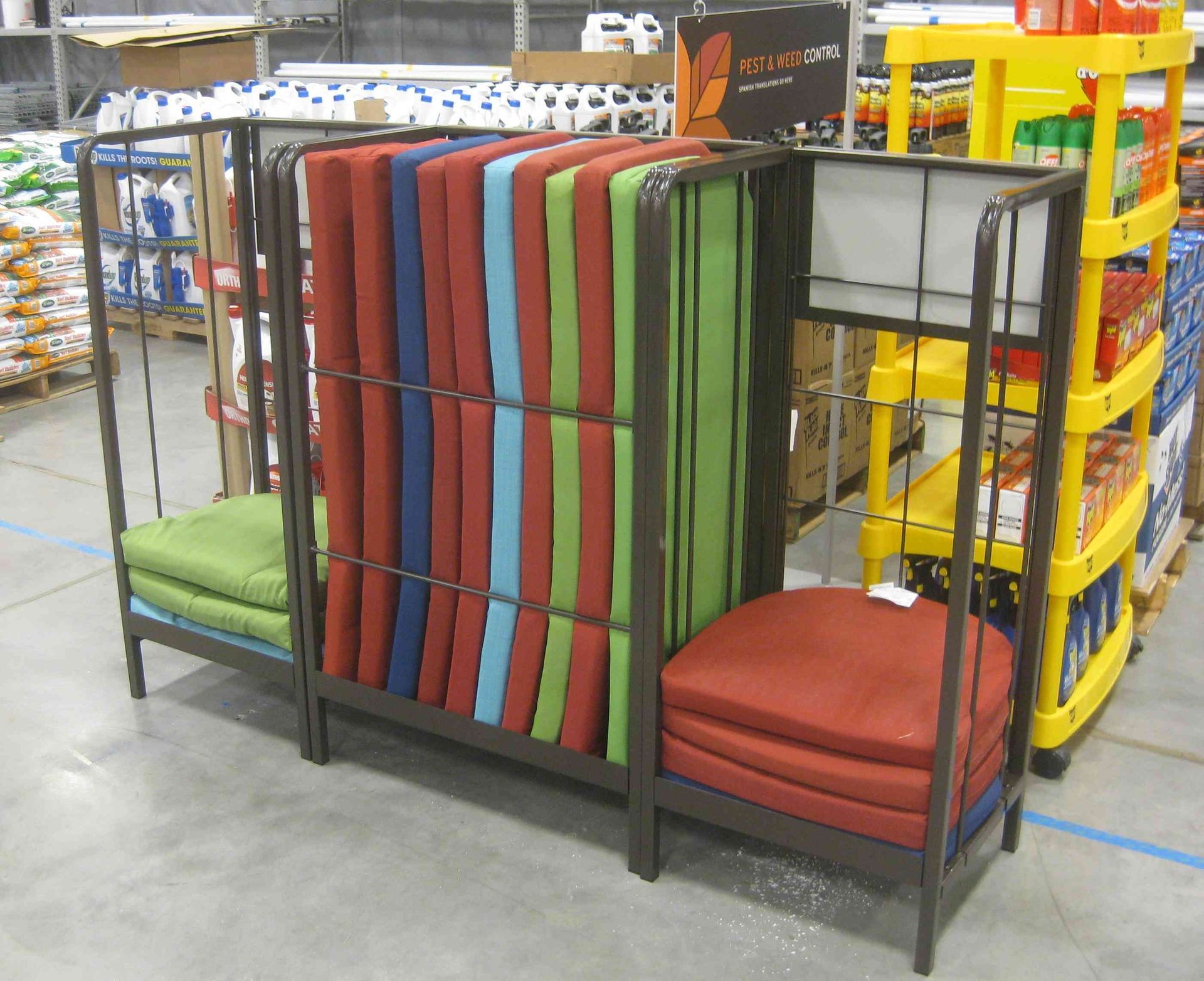 A bunch of cushions are stacked on top of each other in a store