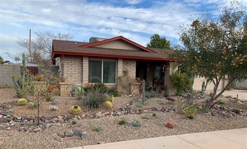 Beautiful modern Arizona xeriscape with desert plants and stone pathway