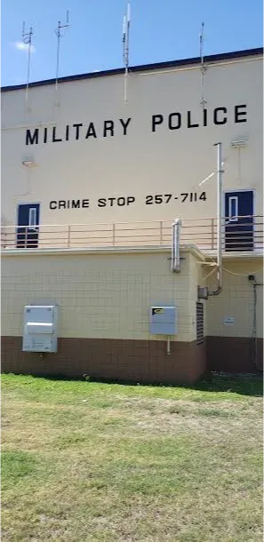 A military police building with a crime stop number